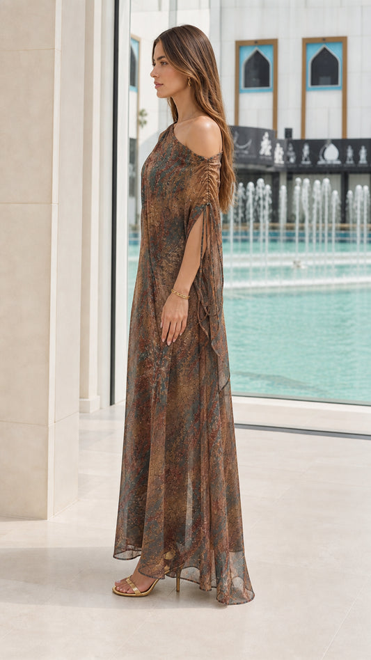 Side view of Bronze Multi one-shoulder printed kaftan dress showing drape and length