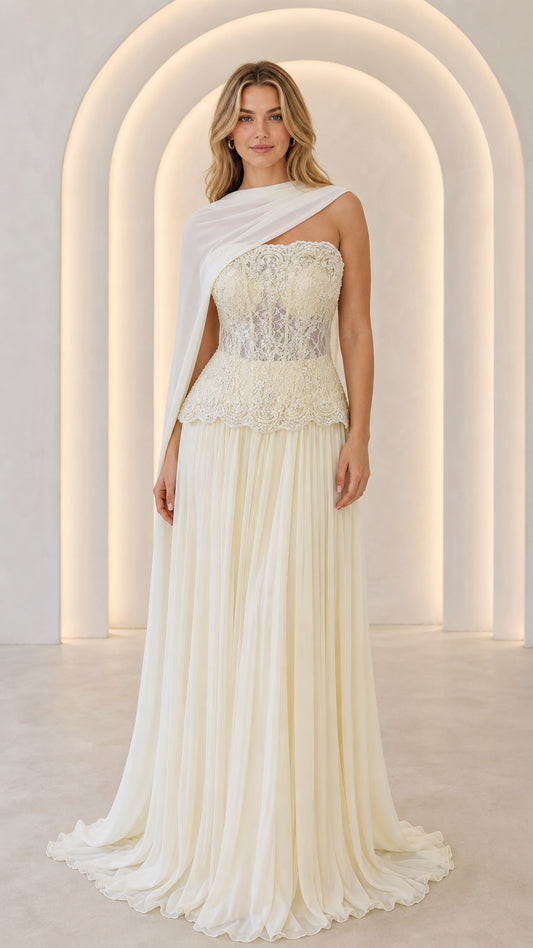 Ivory strapless lace corset maxi gown with pleated skirt and sheer shoulder drape - front view