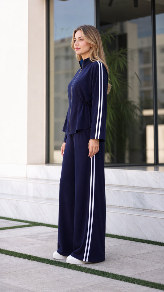 Side profile of women's navy blue wide-leg tracksuit set